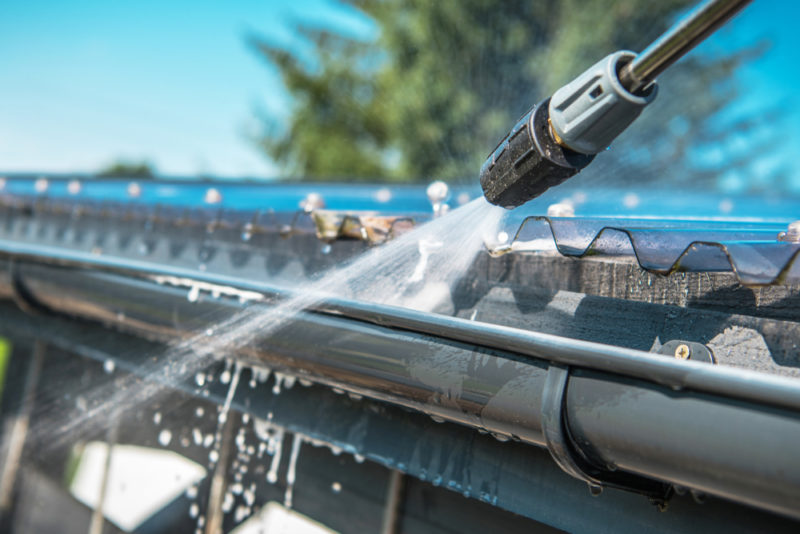 Gutter cleaning using pressure washer