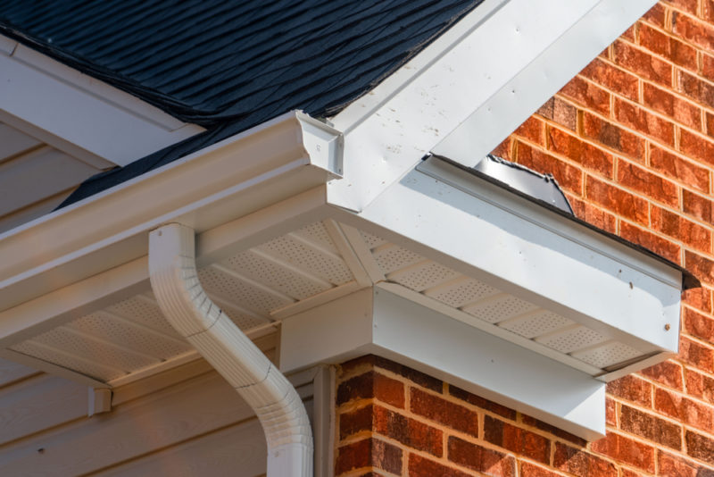 Roof showing gutters and soffit on the back of a brick house